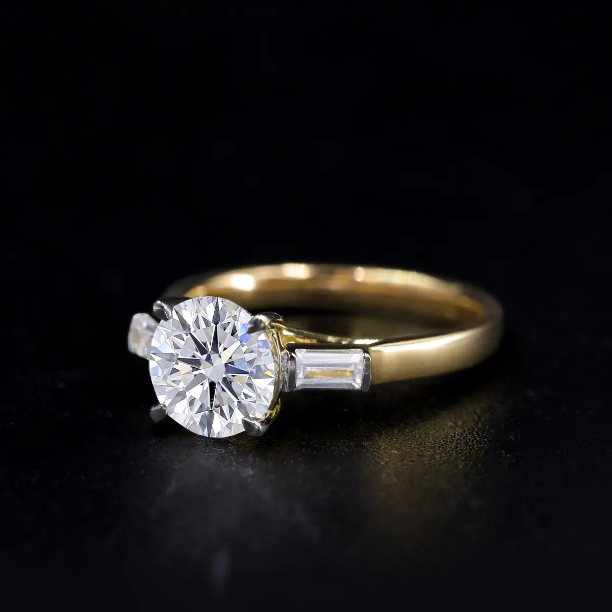Round Solitaire Engagement Ring With Tapered Baguette