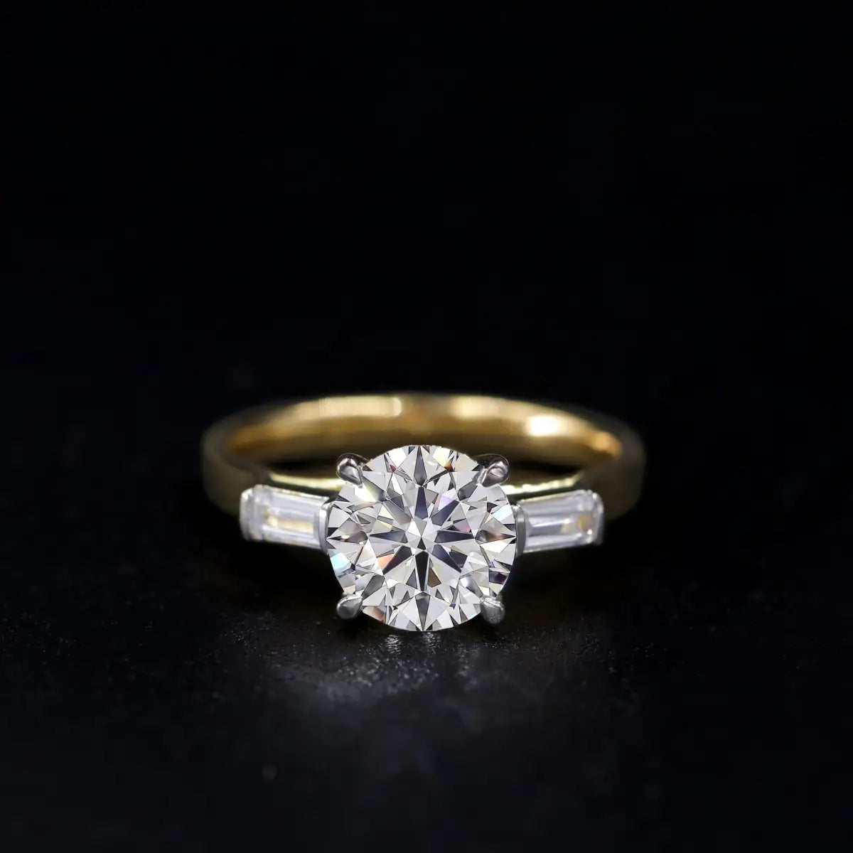 Round Solitaire Engagement Ring With Tapered Baguette
