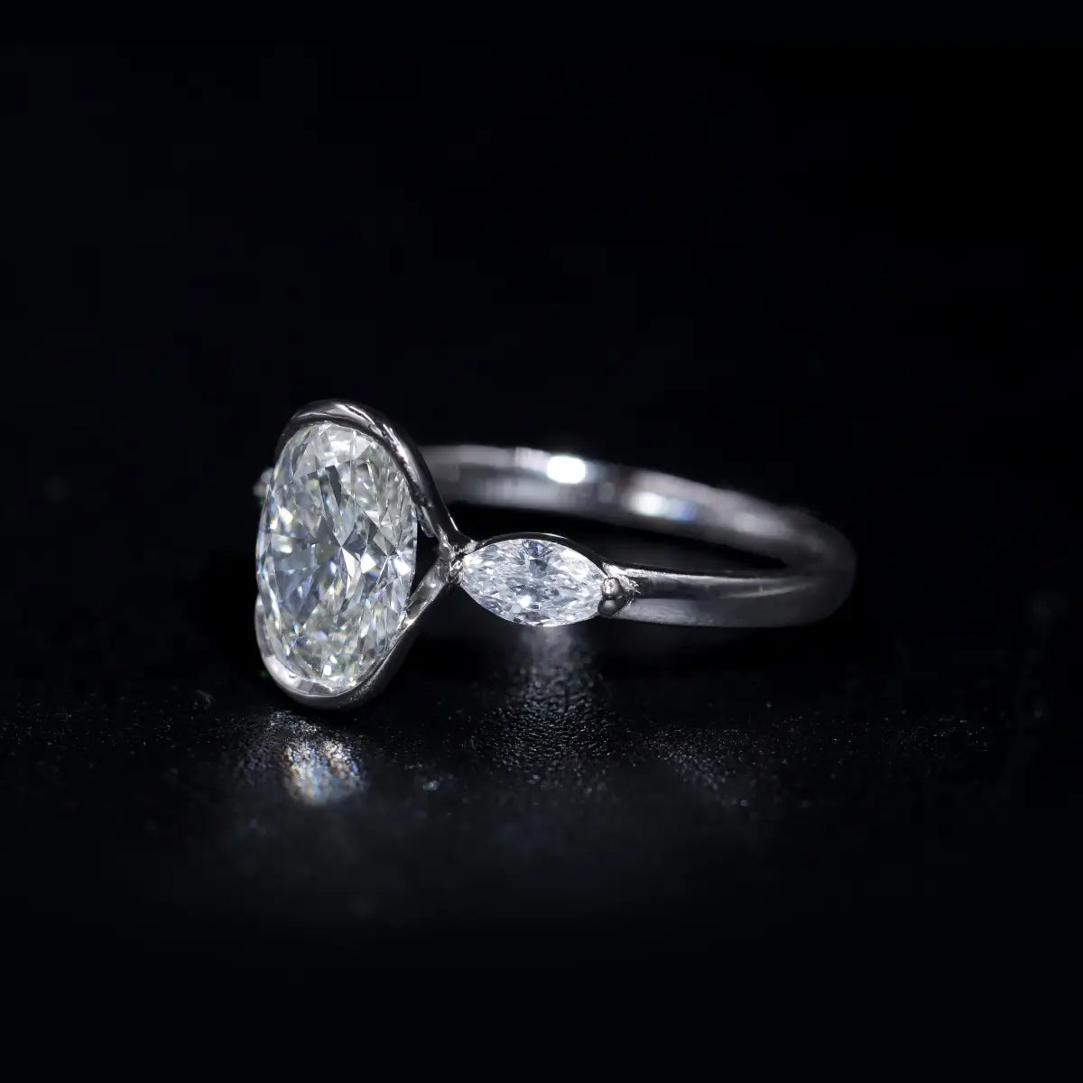 Oval Half Bezel Triple Diamond Engagement Ring